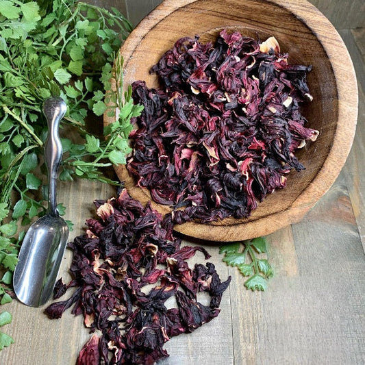 A bowl of organic loose hibiscus flower used for making tea.