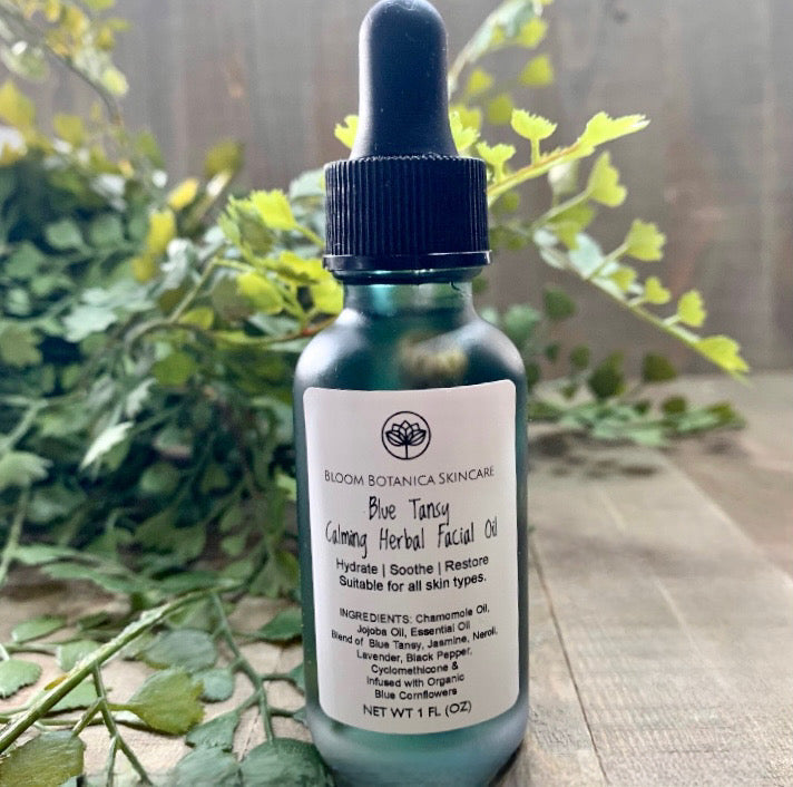 Blue Tansy Herbal Facial Oil in 1 ounce and 1/2 oz. Oil is infused with Chamomile, jojoba oils and essential oils of Blue Tansy, Jasmine, Neroli, Lavender, Black Pepper with a beautiful blue Cornflower further infusing this magical facial oil.