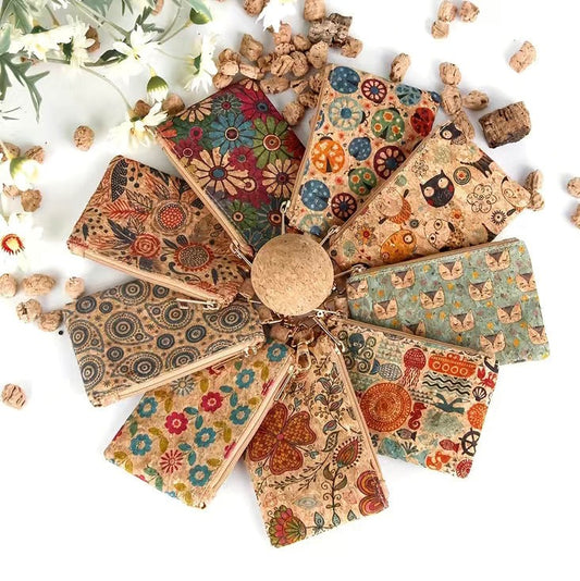 Cute Cork Vintage change purses displayed in a circle. Each measure 4.3 inches by 3 inches and come with a clip for attaching to a beltloop or backpack and a zipper for keeping your money and credit cards safe. 